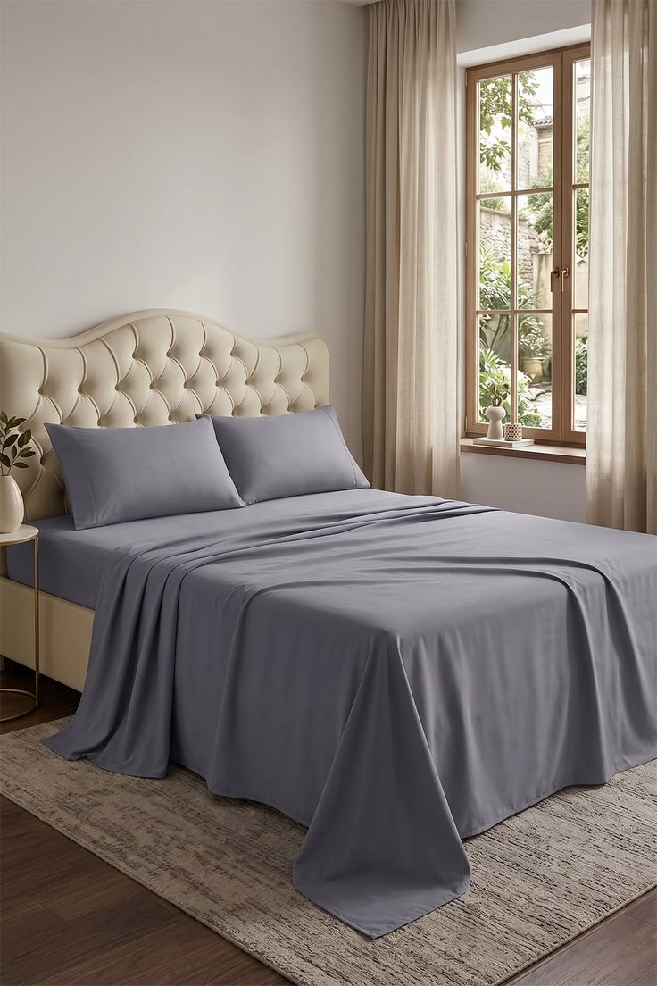 Navy premium sheet set styled on a bed